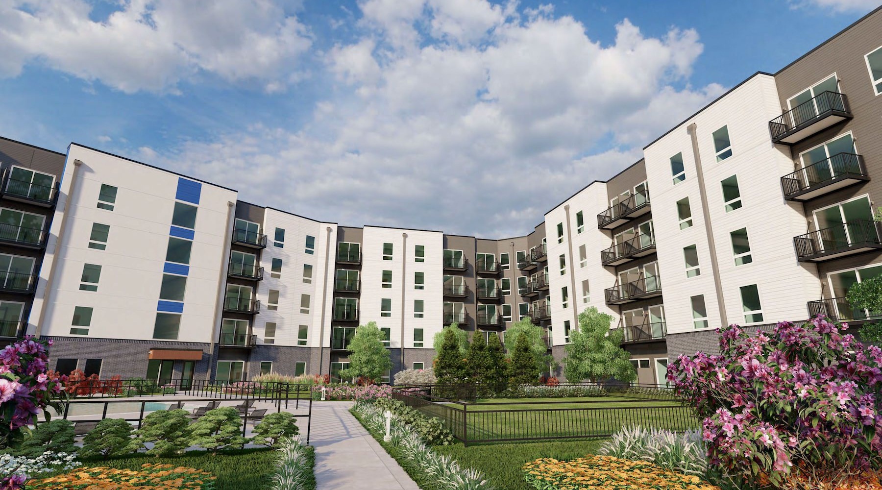 a large building with a garden and many windows